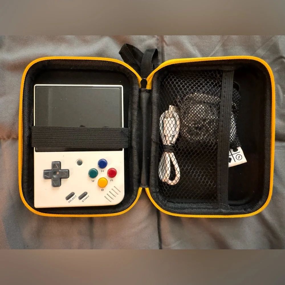 Motion Mini White and Black Handheld Gaming Console with Retro Design